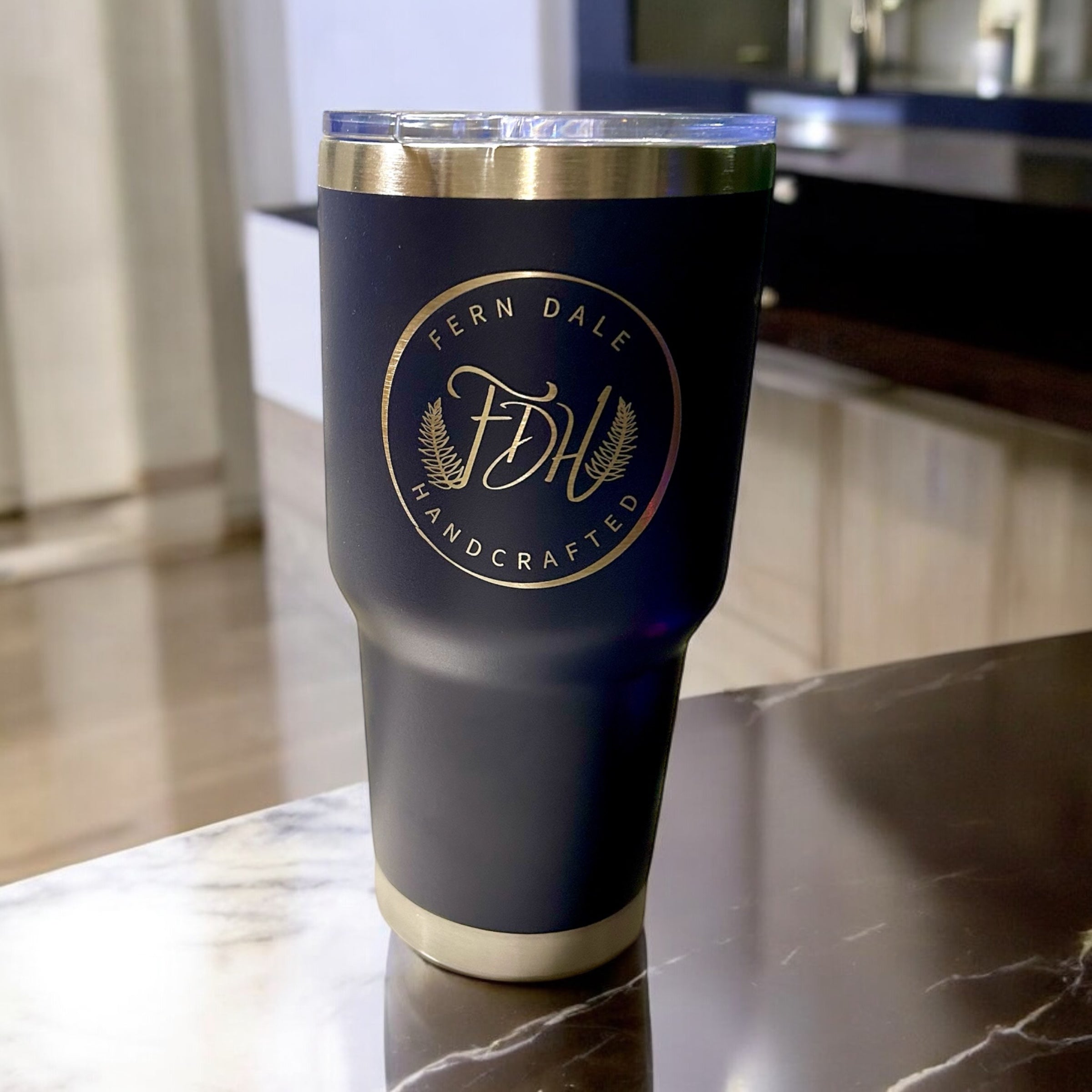 30oz Tumblers shown in black with a clear lid, metallic rim and base, and a circular Fern Dale Handcrafted logo.
