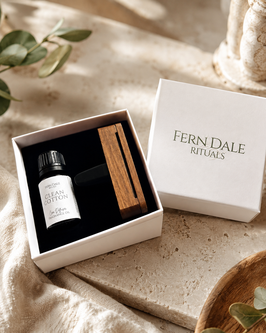 Personalised Wooden Car Diffuser Gift Set with a wooden diffuser and black bottle in an open white box.